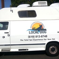 The white Local Dog grooming van